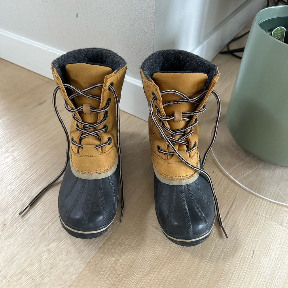 Sorel Tan and Black Winter Boots